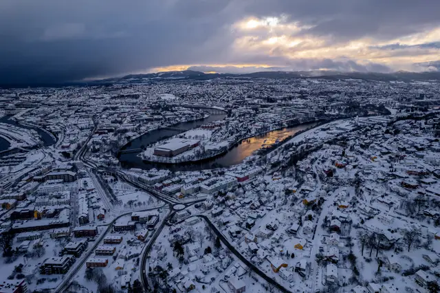An aerial view of a snow-covered Norwegian town.